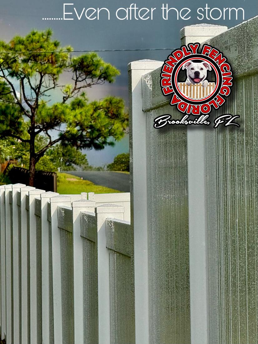 White vinyl fence standing after a Florida storm